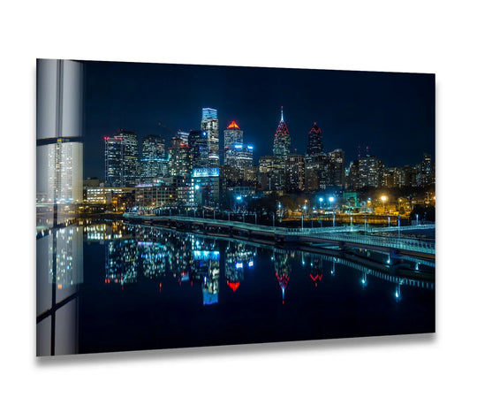 Mysterious Philadelphia glass wall artwork captures the city's illuminated skyline and its mirrored reflections, creating a deeply evocative mood at night.