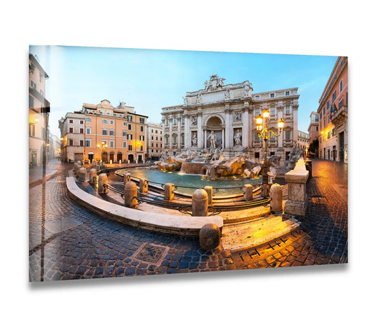 The tranquil mood of the Trevi Fountain at dawn emanates from this print wall art, showcasing Rome's iconic landmark with its illuminated cascading waters.