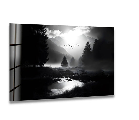 Highlighting the abstract quality, this black and white landscape glass art transforms a forest scene into mesmerizing wall prints with moody light reflecting on the pond.