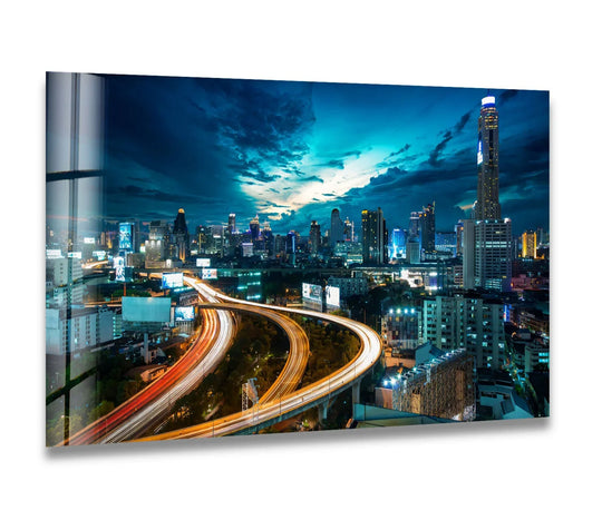 Streaking lights of Bangkok's bustling cityscape are the loudest element in this vibrant glass wall art prints, capturing Thailand’s stunning night view.