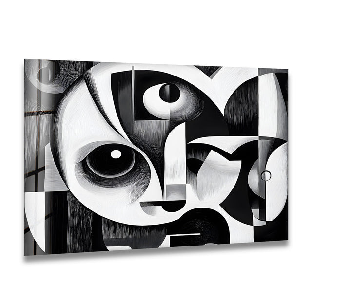 A bold black and white glass wall art featuring a striking cubist-inspired abstract composition.

