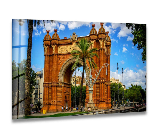 Puffy clouds create a softened backdrop for this Barcelona Arch decorative wall art, showcasing the Arc de Triomf historic landmark in Spain.