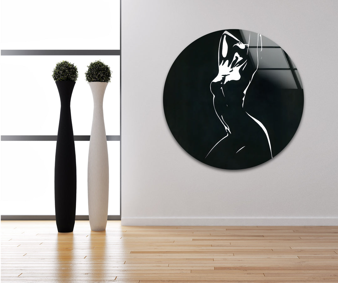 Timeless and artistic glass wall art featuring a graceful abstract female figure in black and white.