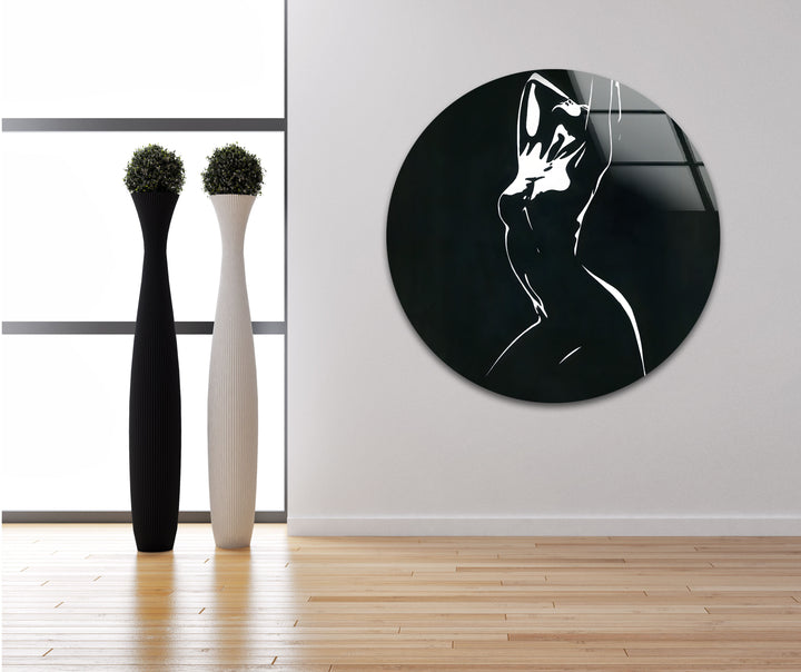 Timeless and artistic glass wall art featuring a graceful abstract female figure in black and white.