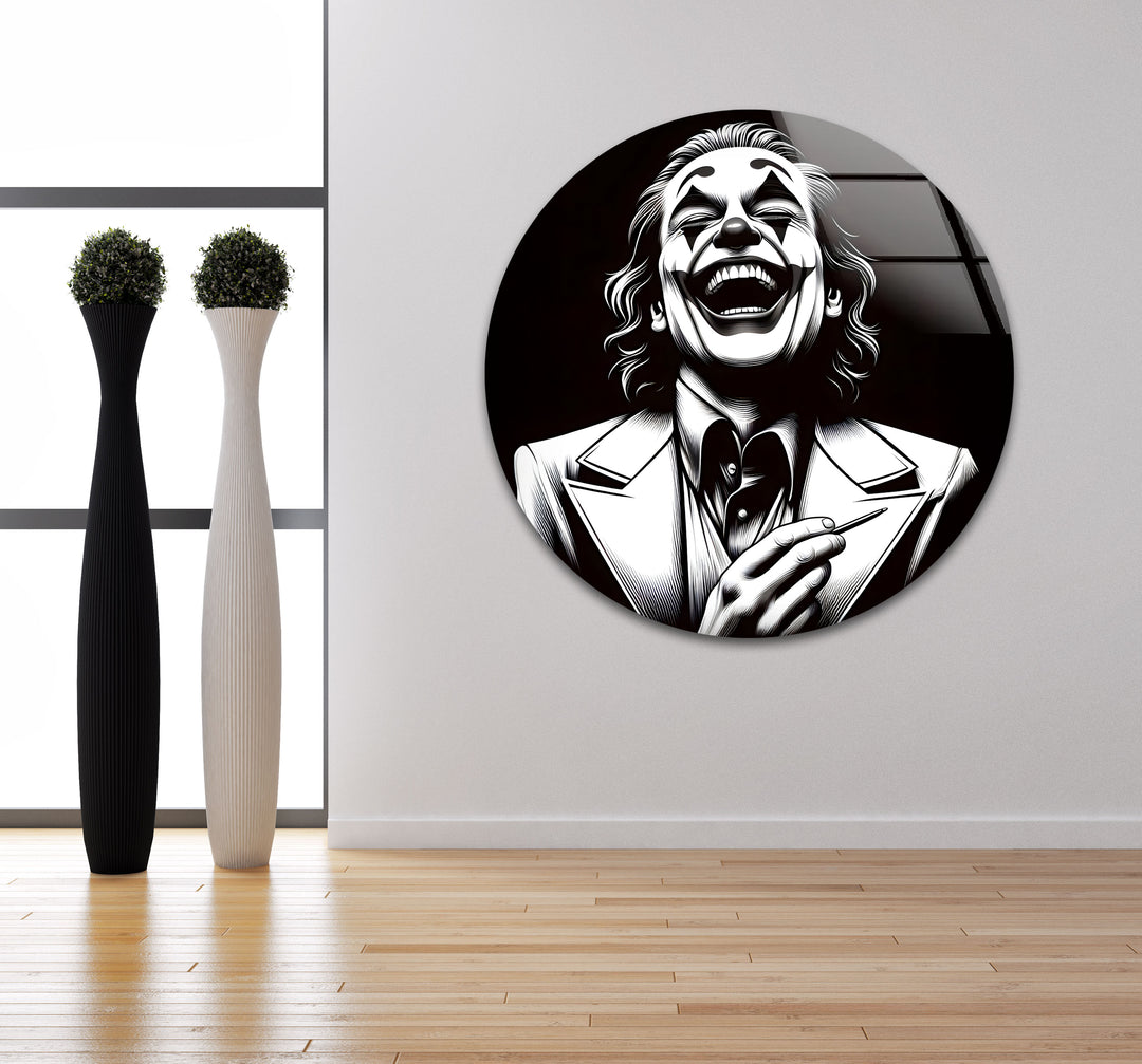 A bold black and white glass art piece that captures the haunting laughter of a clown, perfect for contemporary decor.

