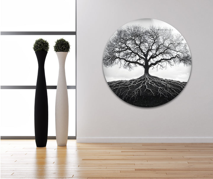A timeless black and white glass wall art capturing the beauty of a tree and its deep-rooted foundation.

