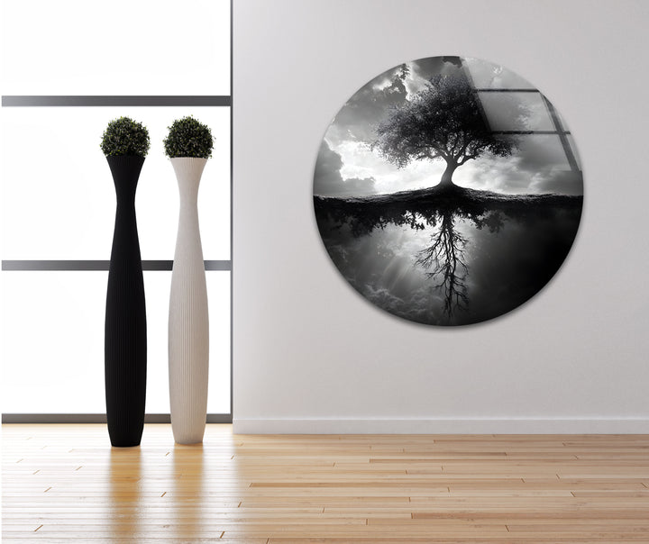 A powerful depiction of life and nature through a black and white tree reflection on glass wall art.
