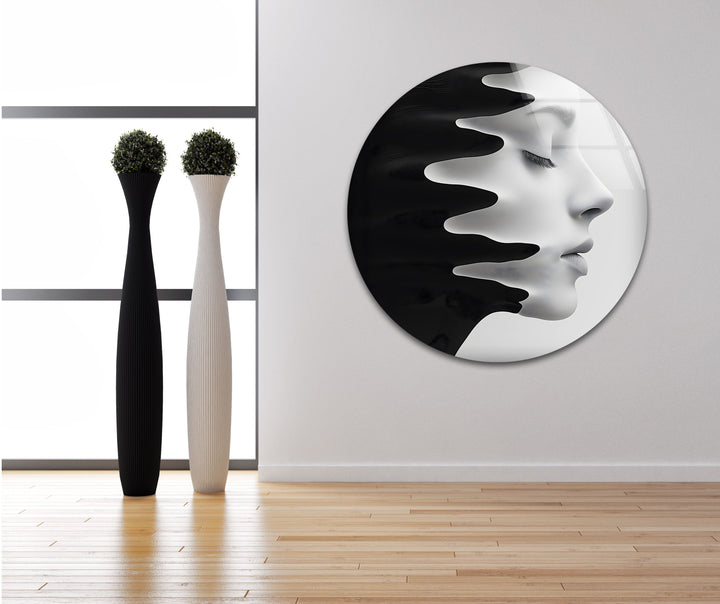 Artistic glass wall decor with a profile blending into fluid black elements.
