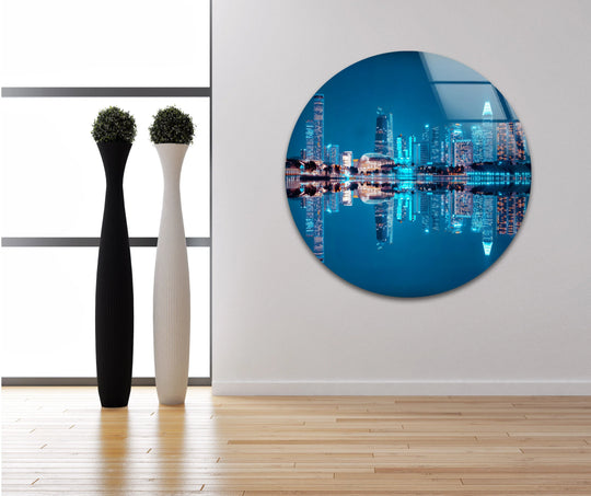 Illuminated skyscrapers and their bright reflections dominate this Singapore Skyline glass wall art, enhanced through vibrant glass printing to capture the iconic cityscape.