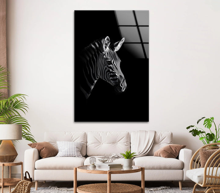 Monochrome zebra portrait on glass with strong contrast and elegant stripe patterns.