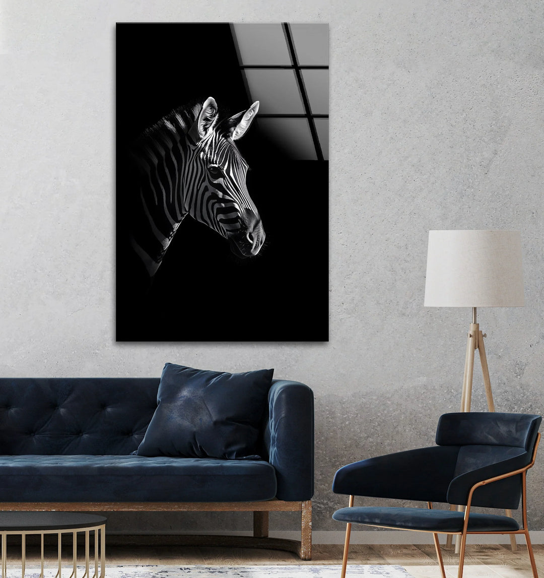 Monochrome glass art featuring a zebra in dramatic lighting against a deep black backdrop.