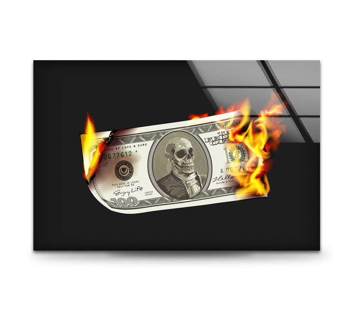 a hundred dollar bill on fire on a black background