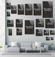 a living room with a couch a table and some pictures on the wall