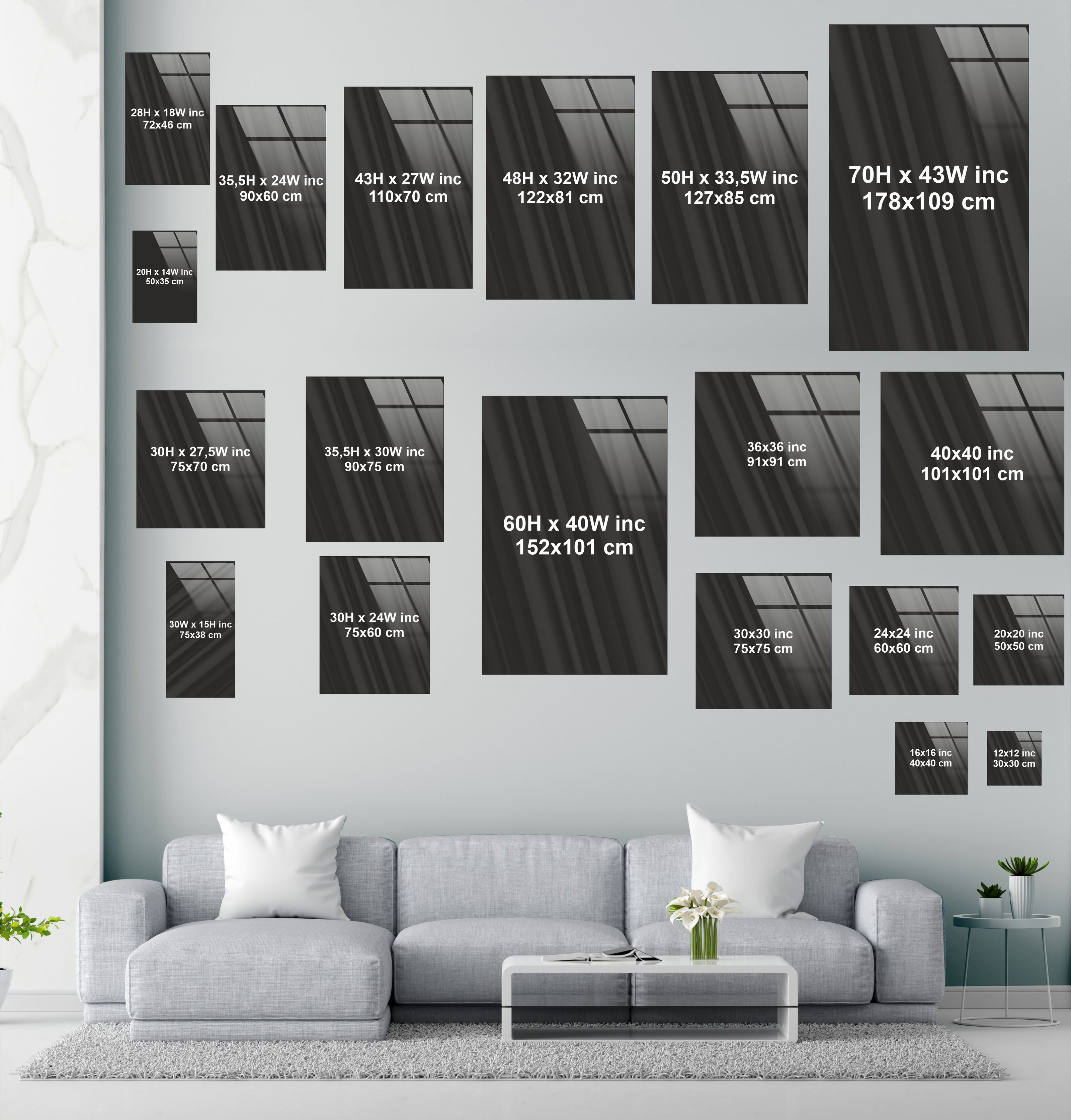 a living room with a couch a table and some pictures on the wall
