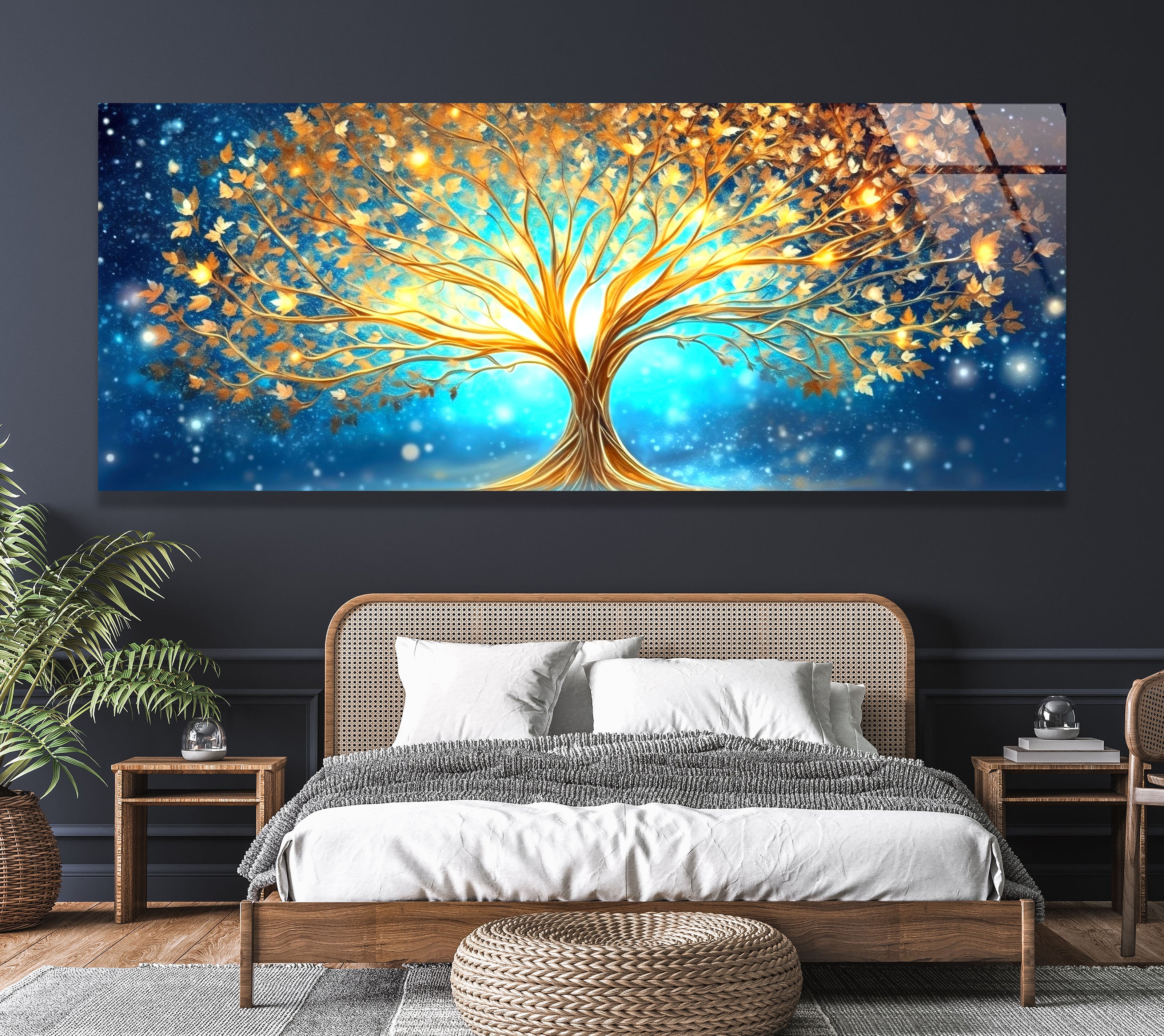a painting of a tree on a wall above a bed