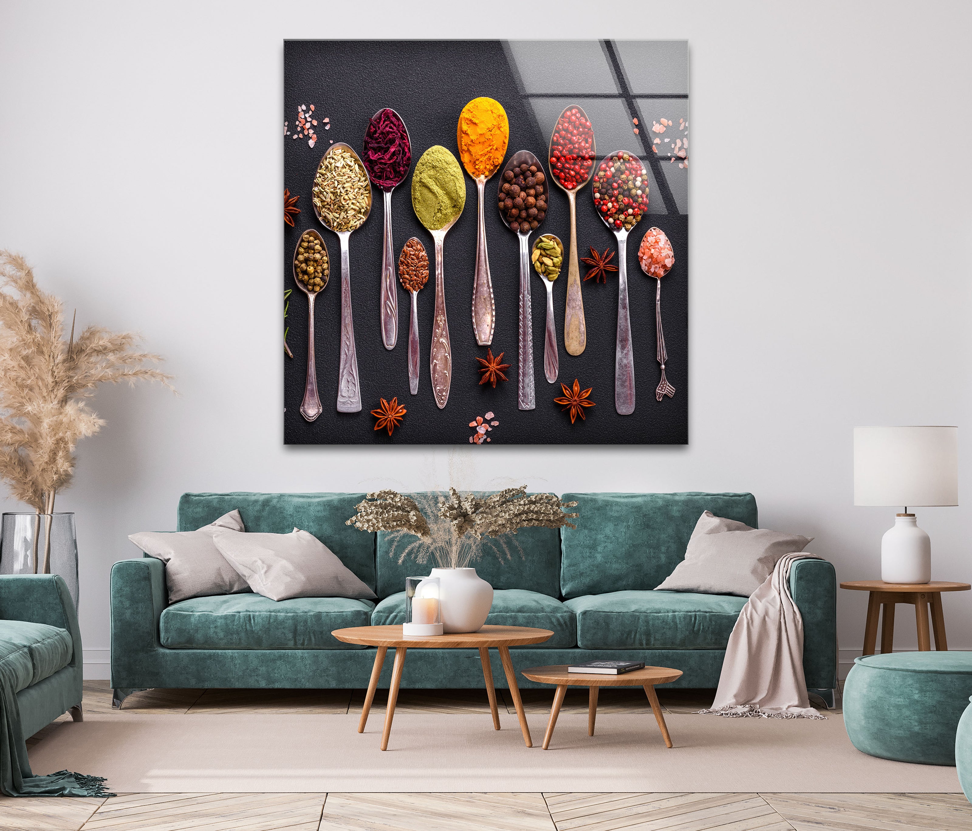 a living room with a couch and a painting of spoons on the wall