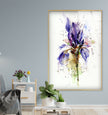 a painting of a purple flower in a living room