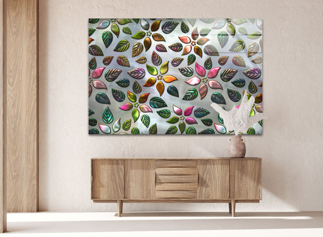 a painting of leaves on a wall above a dresser