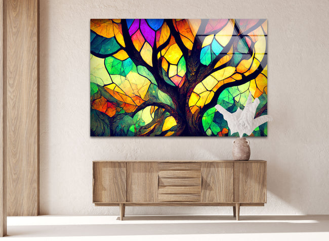 a painting of a tree on a wall above a dresser