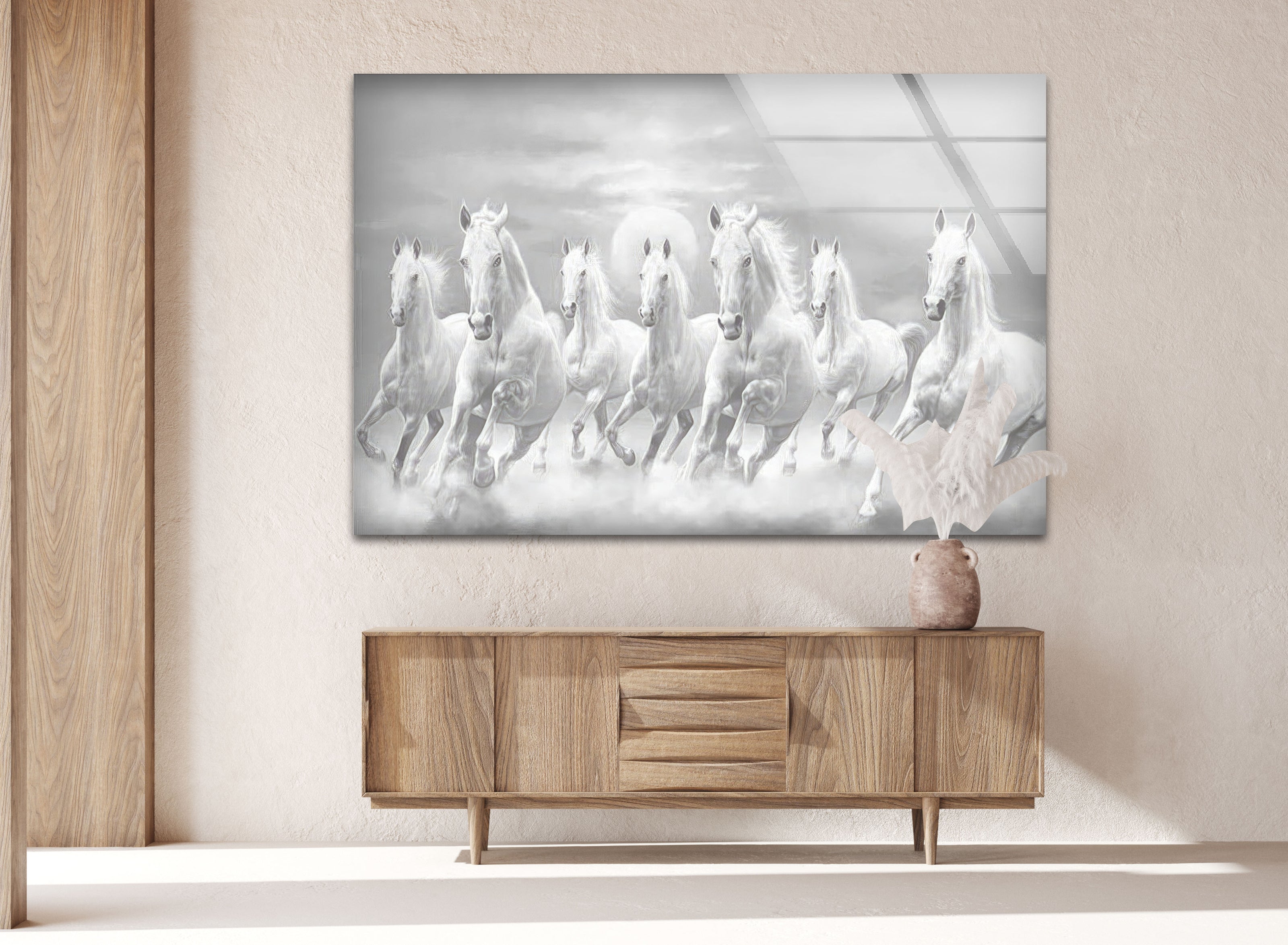 a painting of a group of white horses running