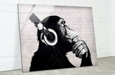 a black and white picture of a monkey with headphones