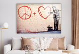 a living room with a white couch and a peace sign on the wall