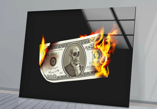 A hundred dollar bill with a skull and flames erupts in a bold statement on this glass art piece.