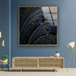 a living room with blue walls and a painting on the wall