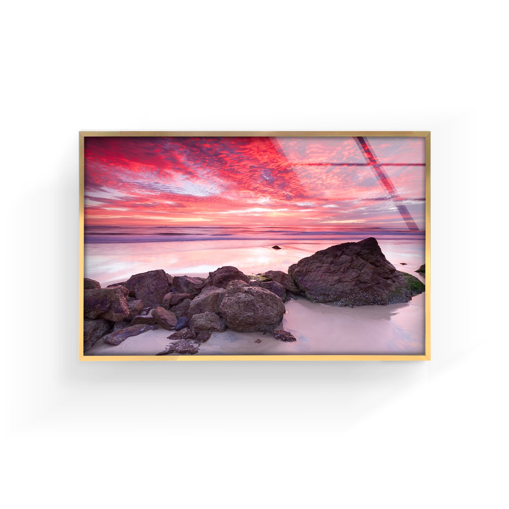 a picture hanging on a wall of a beach