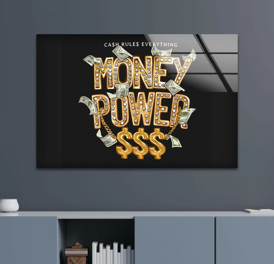 A lavish tempered glass wall art piece radiates an opulent mood with sparkling gold 'Money Power' lettering and cascading dollar bills.