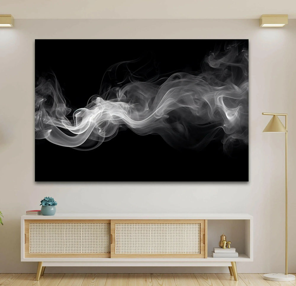 Monochrome glass artwork showing delicate white smoke forming fluid shapes in darkness.