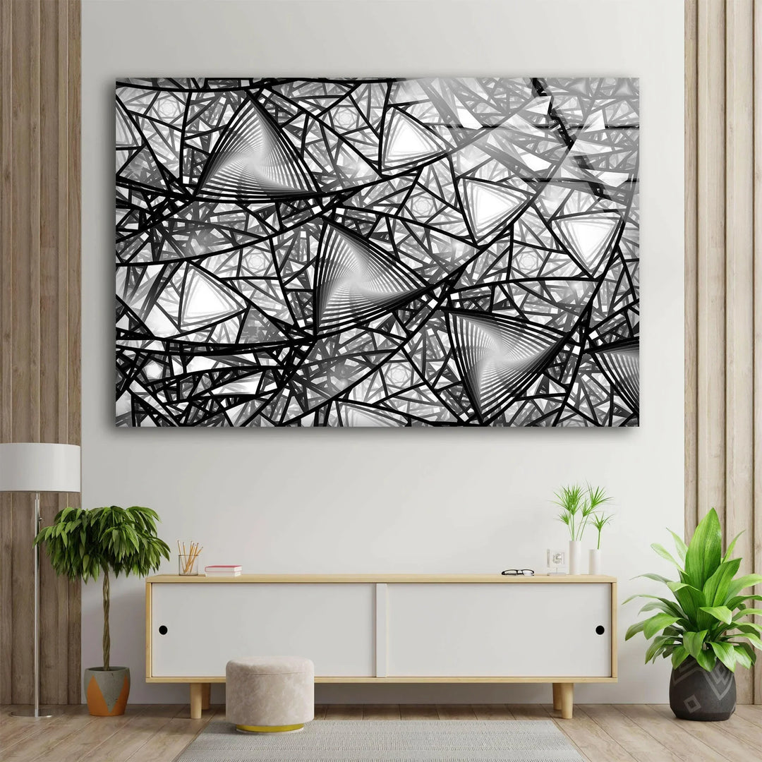 Intricate monochrome abstract design with repeating triangles and dynamic linear structures on glass.
