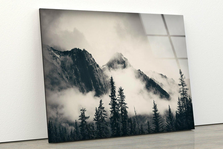 Majestic black and white mountain scene with misty atmosphere printed on glass wall art.