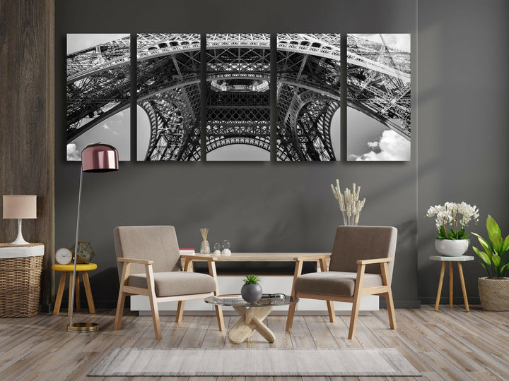 High-contrast Eiffel Tower underside view highlighting geometric lattice design.
