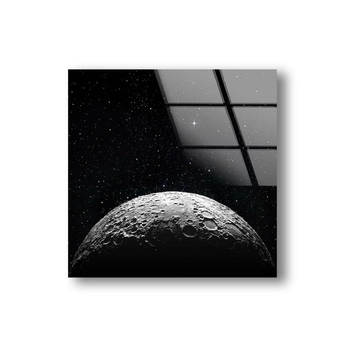 Monochrome moon surface rising into a deep starry background on modern glass wall art.