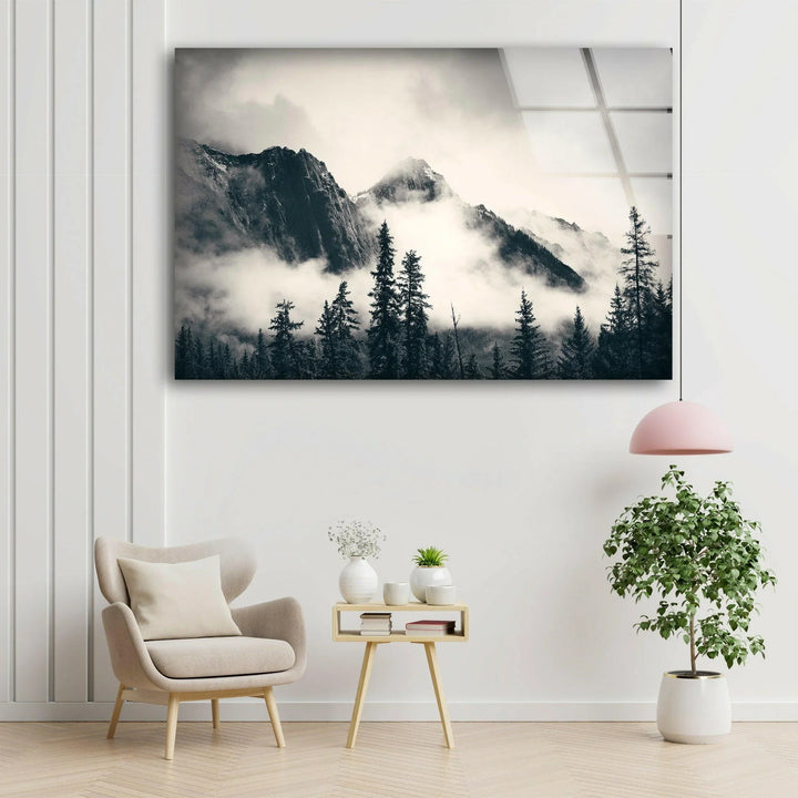 High-contrast mountain peaks emerging through mist on modern glass wall art.