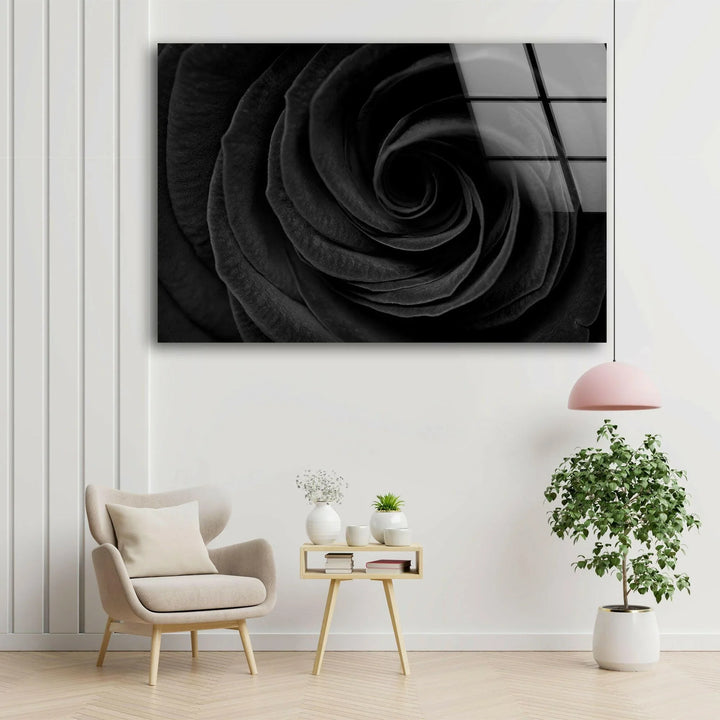 Abstract floral spiral from a dark rose captured in black and white on glass.