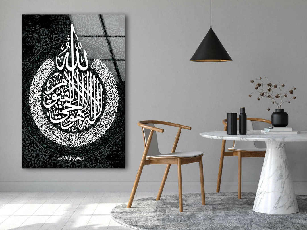 Black and white wall art showcasing ornate Islamic calligraphy with layered circular detailing.