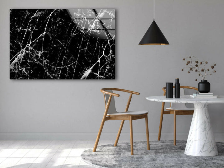 High-contrast marble pattern featuring intricate white cracks on deep black glass décor.