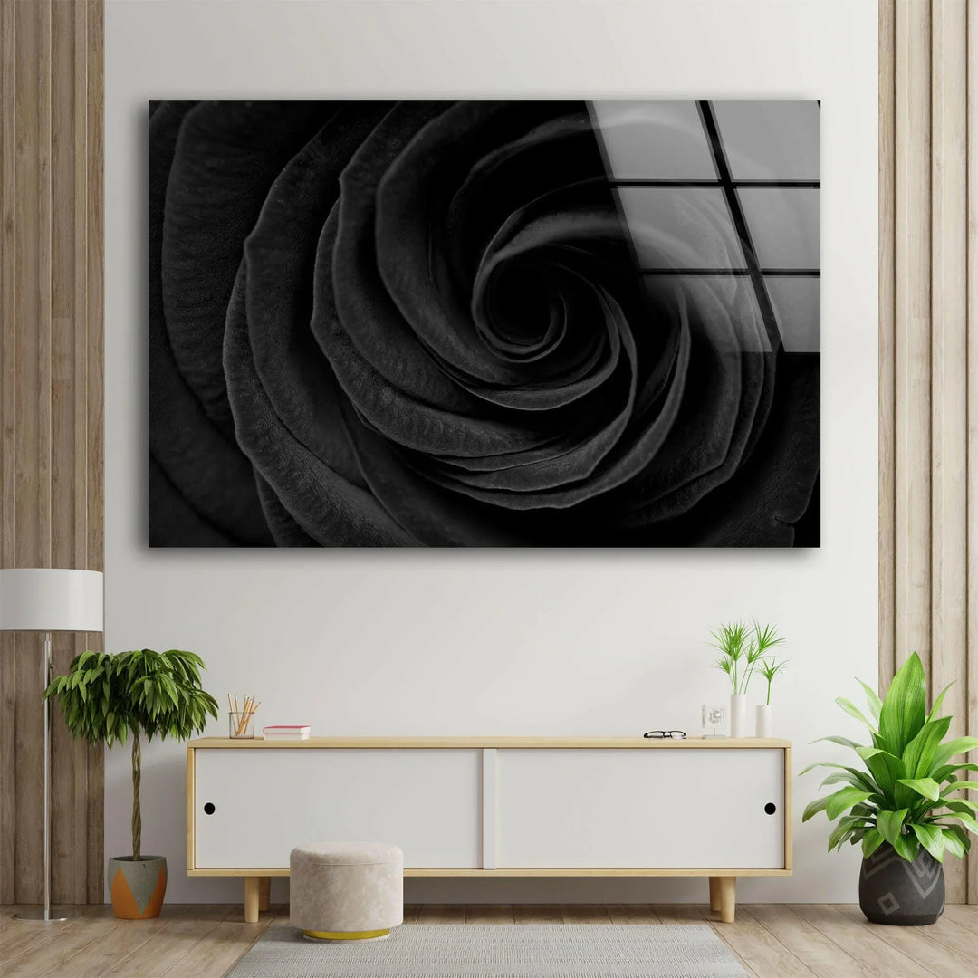 Detailed black rose swirl texture creating bold floral wall art on glass.