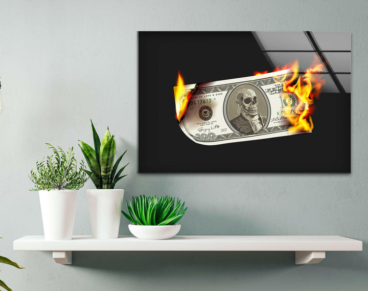 a picture of a burning dollar bill on a shelf