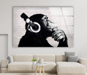 a living room with a couch and a painting of a monkey with headphones