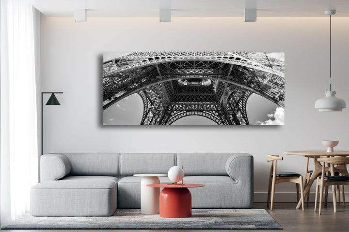 Artistic upward perspective of the Eiffel Tower printed on sleek glass wall decor.