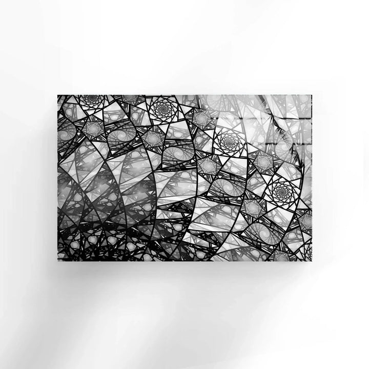 Monochrome fractal arrangement showcasing layered spirals and lines on glass panel.