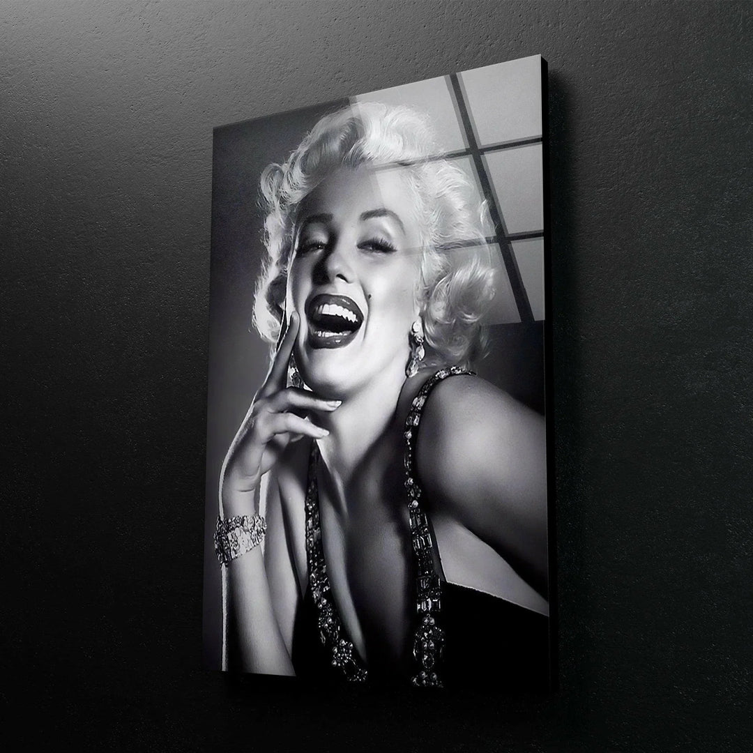 Marilyn Monroe Black and white glass wall art featuring a glamorous smiling woman with vintage Hollywood styling.