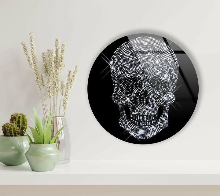 Glass art featuring a bright crystal skull with gem-like detailing on a black backdrop.