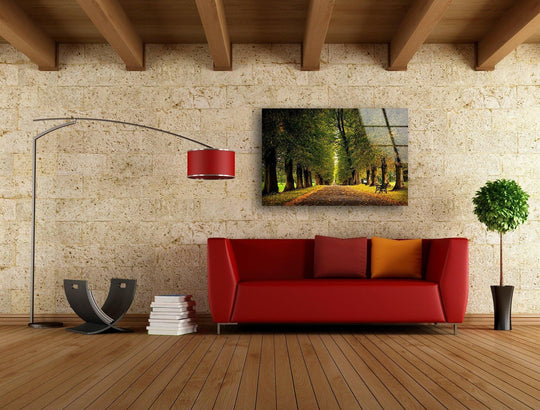 Nature Forest glass wall art shows a tree lined path with golden autumn leaves and is landscape photography and forest wall art for nature paintings