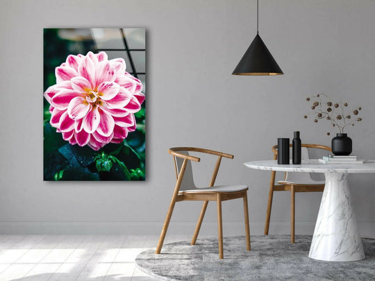 Against a subtly textured gray wall, the vivid color pink flower glass wall art enhances the minimalist home decor setting with its sleek, reflective surface.