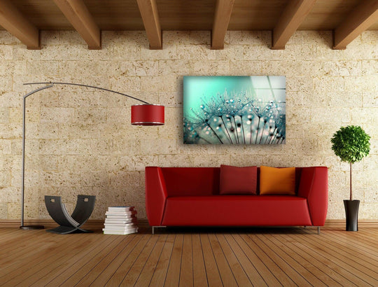 Vibrant turquoise and deep teal colors transition on this glass wall artwork featuring dew drops on dandelion seeds.