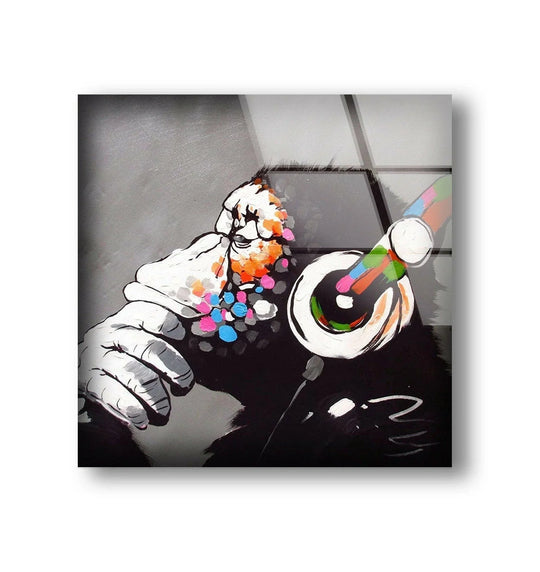 Vibrant multicolor dots explode around the hands of a thoughtful monkey in this striking glass wall artwork.